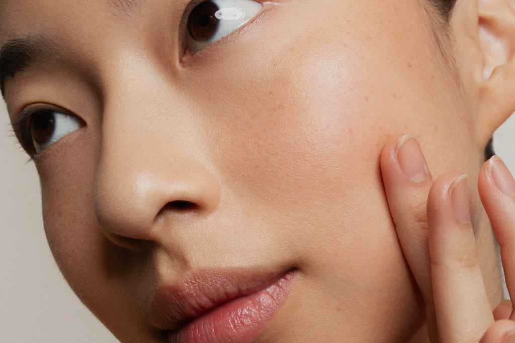 Woman with clear skin, Z Clear Shikimic Hydroxy-Biome Facial Serum tagline Clear skin. Intelligently delivered