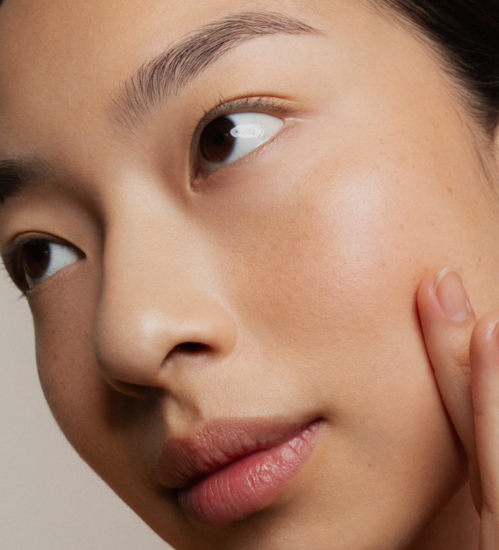 Woman with clear skin, Z Clear Shikimic Hydroxy-Biome Facial Serum tagline Clear skin. Intelligently delivered